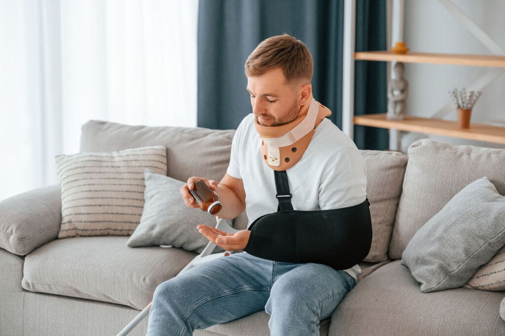 Man-takes-pills-when-recovering-from-workplace-injury